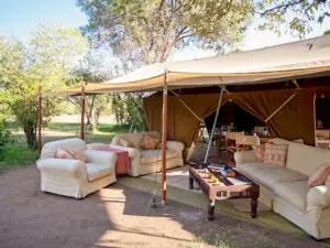 Head for the shaded sofas of the camp's lounge to relax & swop safari stories.