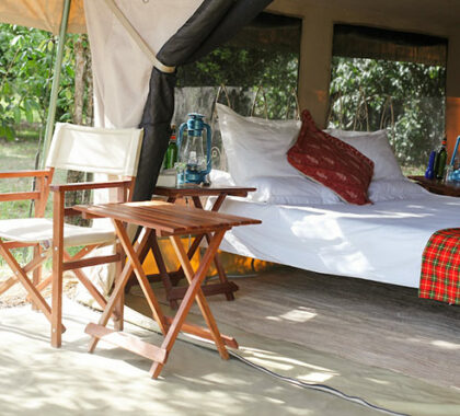 Simple & practical, each tented suite at Nkorombo opens onto a seating area with chairs & table.
