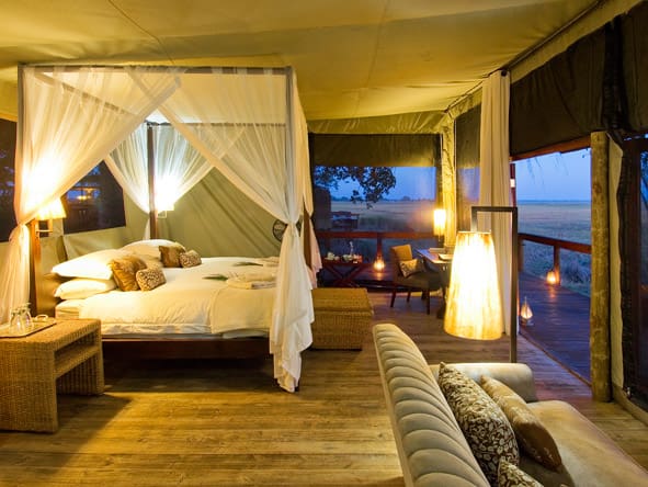 Returning from an evening game drive, your lamp-lit suite makes a welcome sight.