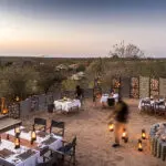 A lantern-lit boma dinner awaits!