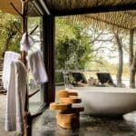 Bush suite bathroom at Singita Boulders Lodge.