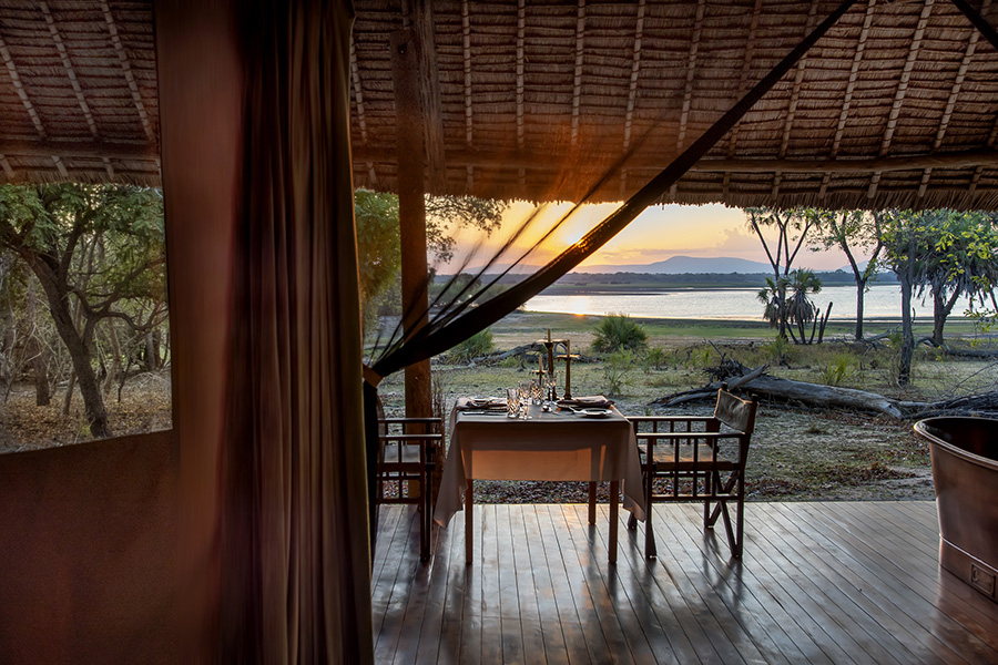 Siwandu_Private-dinner-set-up-in-tented-suite-with-view-over-Lake-Nzerakera