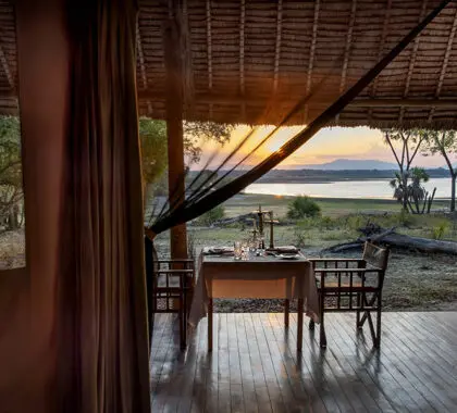 Siwandu_Private-dinner-set-up-in-tented-suite-with-view-over-Lake-Nzerakera