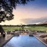 An exquisite view from the deck and an inviting swimming pool.