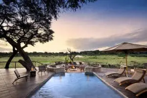 An exquisite view from the deck and an inviting swimming pool.