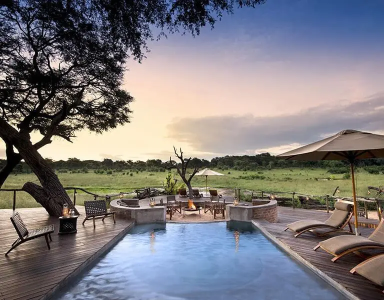 An exquisite view from the deck and an inviting swimming pool.