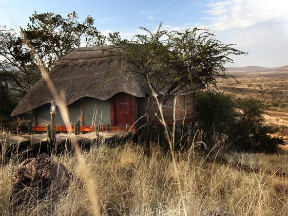 The lodge is situated on a hillside overlooking the Serengeti National Park.