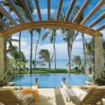 Spend long sunny days at the pool at One&Only Le Saint Geran under the shade of rustling palm trees.