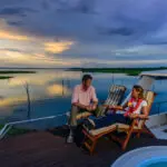 Take in the exceptional views of Lake Kariba as dusk settles over the water.
