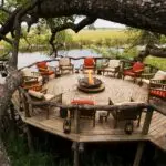 Swop safari stories around the campfire at Xakanaxa Camp, set in a game-rich area of the Moremi Game Reserve.