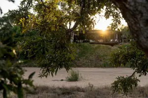tanda-tula-safari-camp-exterior-main-area-sunset