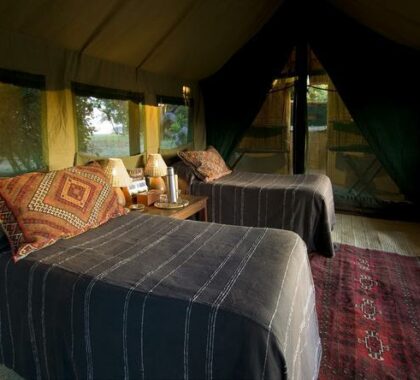 Expect comfortable beds and a tent decorated in typical safari flair.