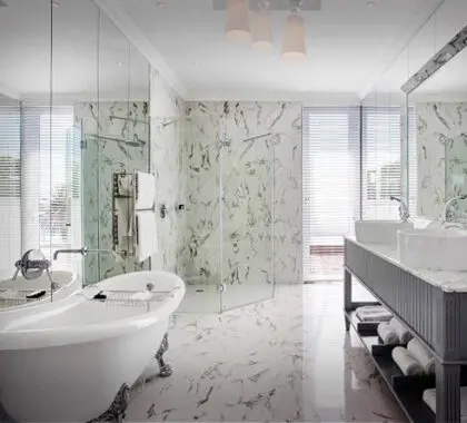 All bathrooms at The Marly come complete with a large bath & rain shower.