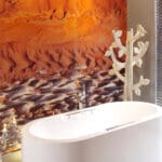 Indulge in a candlelit bubble bath in your sleek, free-standing bathtub.