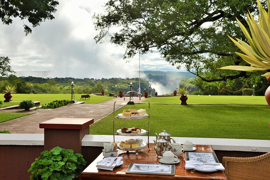 An iconic high tea with the spray of Victoria Falls in view.