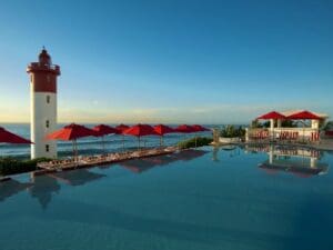 One of South Africa's coastal landmarks, The Oyster Box has amazing views of the ocean and lighthouse.