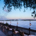 Enjoy a romantic dinner with a view of the spray of Victoria Falls.