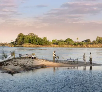 Sundowners on a small river island during a river rafting excursion.