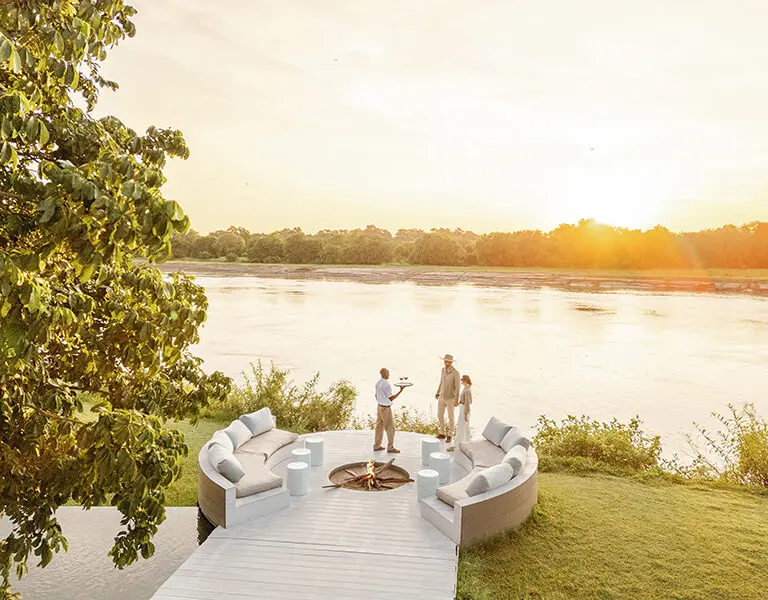 Enjoy a sundowner by a crackling fire.