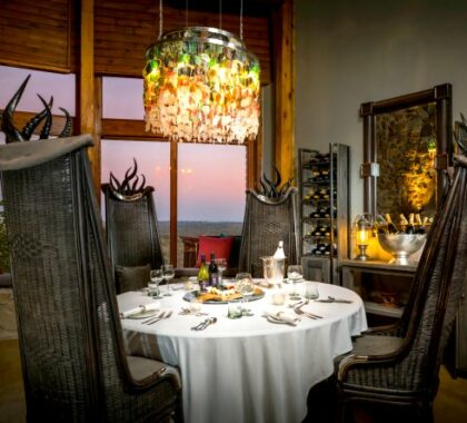 Take in the panoramic views while enjoying a meal at the Ulusaba Rock Lodge wine tasting room.

