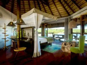 The bedroom opens up onto a private deck, providing panoramic views.
