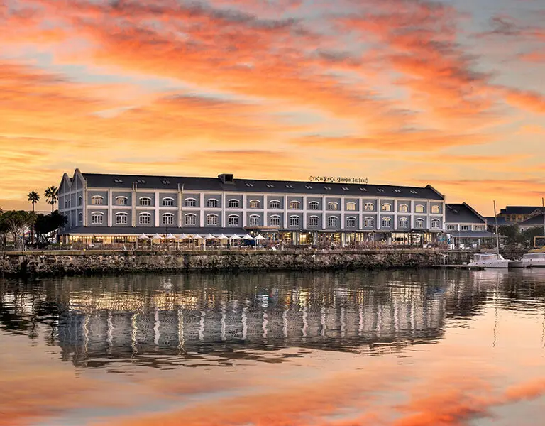 Exterior golden hour view of the Victoria & Alfred Hotel.