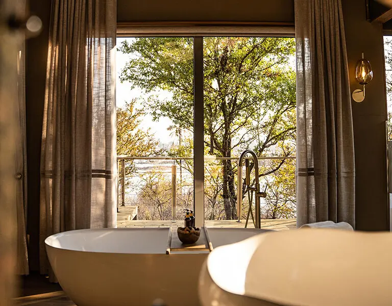 victoria-falls-river-lodge-_superior-family-tent-view-bath