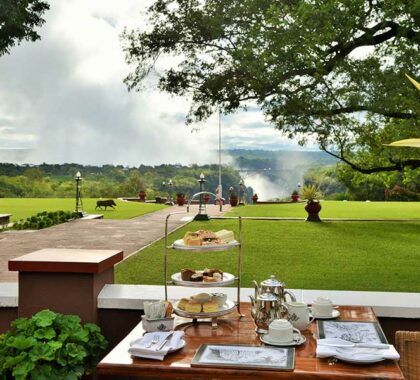 View of the Victoria Falls sprays from the Victoria Falls Hotel as you enjoy their famous high tea.