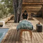 Indulge in a massage treatment on your tented suite's deck.