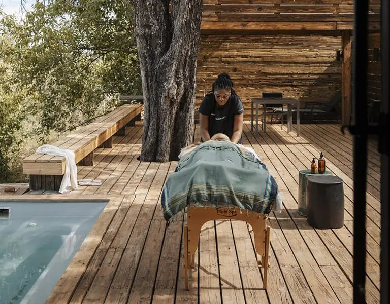 Indulge in a massage treatment on your tented suite's deck.