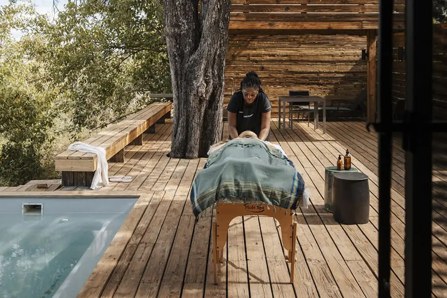 Indulge in a massage treatment on your tented suite's deck.