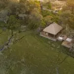 Vumbura Plains aerial view of a tented suite, in the Okavango Delta, bordering the Moremi Game Reserve.
