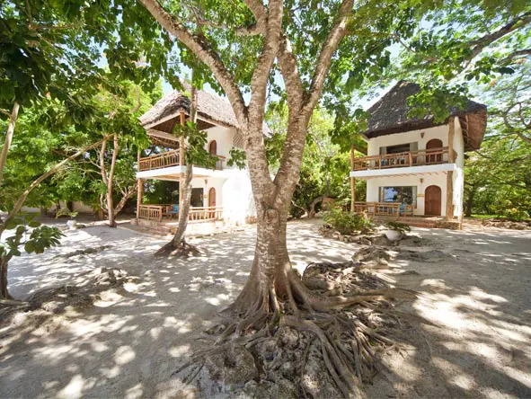 The suites at Waterlovers are tucked away in the shade, just back from the beach.