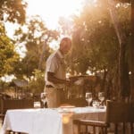 Dining out on the deck in the shade of the trees around camp. 