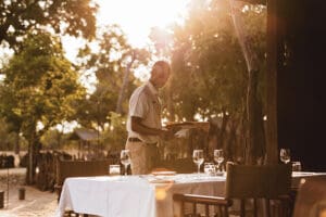 Dining out on the deck in the shade of the trees around camp. 