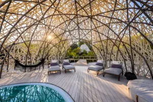 The swimming pool deck, shaded by a uniquely designed dome. 