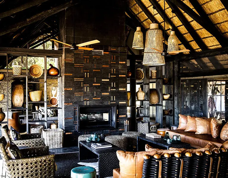 A  a thatch-covered bar and dining area whose aesthetics are in complete harmony with the natural environment.