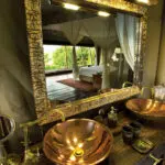 Each en-suite bathroom is luxurious and opulent, with gilt-edged mirrors and dual copper wash basins.