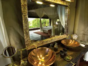 Each en-suite bathroom is luxurious and opulent, with gilt-edged mirrors and dual copper wash basins.