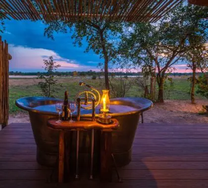 Soak in a bath that has views of the Kapamba River.