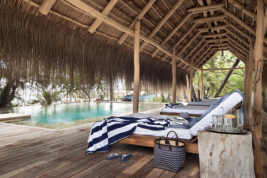 Relax on the poolside loungers.