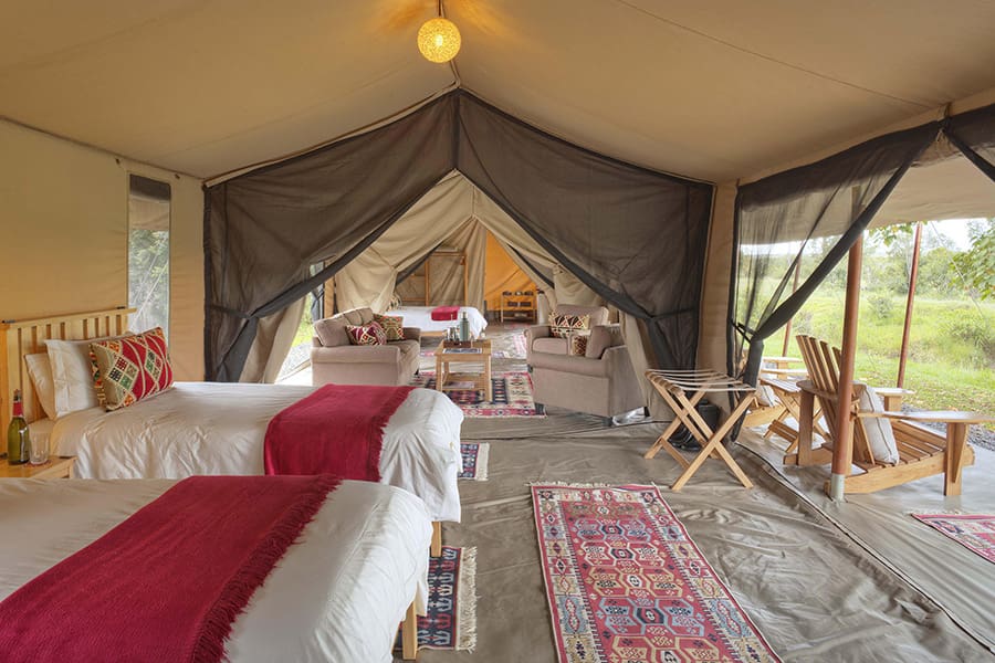 asilia_ol_pejeta_bush_camp_-_family_room_-_twin_set-up_with_view_into_lounge_and_main_bedroom1-3