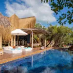 Ease yourself into your day with morning coffee by the pool.