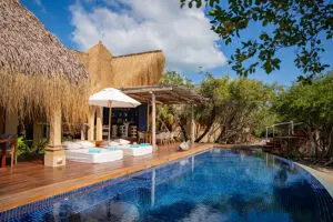 Ease yourself into your day with morning coffee by the pool.