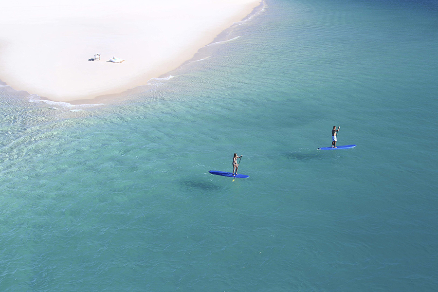 Enjoy the azure waters by stand-up paddle board or kayak. 