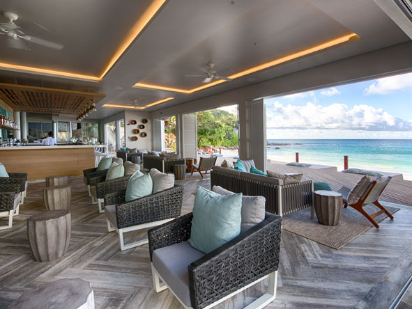 At the bar area, you can enjoy a tropical cocktail and soak up the views in style.

