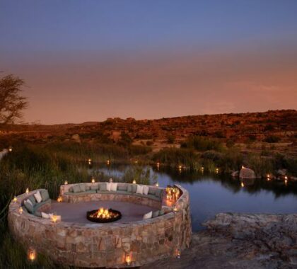 Enjoy a sundowner at the boma overlooking the river
