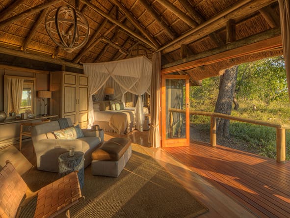 Modern styled thatched safari tents with private decks offering views over the Moremi Game Reserve.