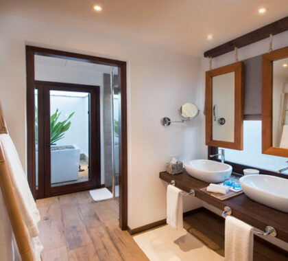 Each large en suite bathroom has twin basins, a walk-in shower and an open-air outdoor shower.
