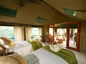 Spacious bedrooms feature wooden furnishing, comfy beds and large mesh windows.
